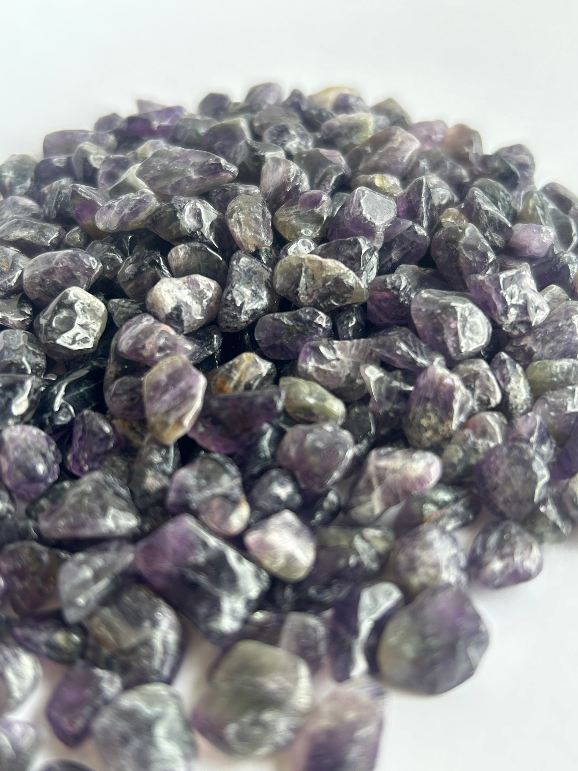 Amethyst gemstones spread out and displayed to show style